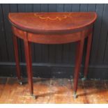 A 19th century mahogany crossbanded and inlaid demi-lune card table, the hinged top with inlaid