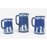 A set of three Wedgwood jasperware graduated jugs, decorated with neo-classical maidens, having