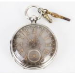 A Victorian Silver Cased Open Dial Key Wound Pocket Watch with ornate gold detailed dial, the