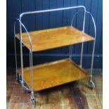 A Gerlinol chrome and teak folding two-tier tea trolley, on casters, 87cm long.