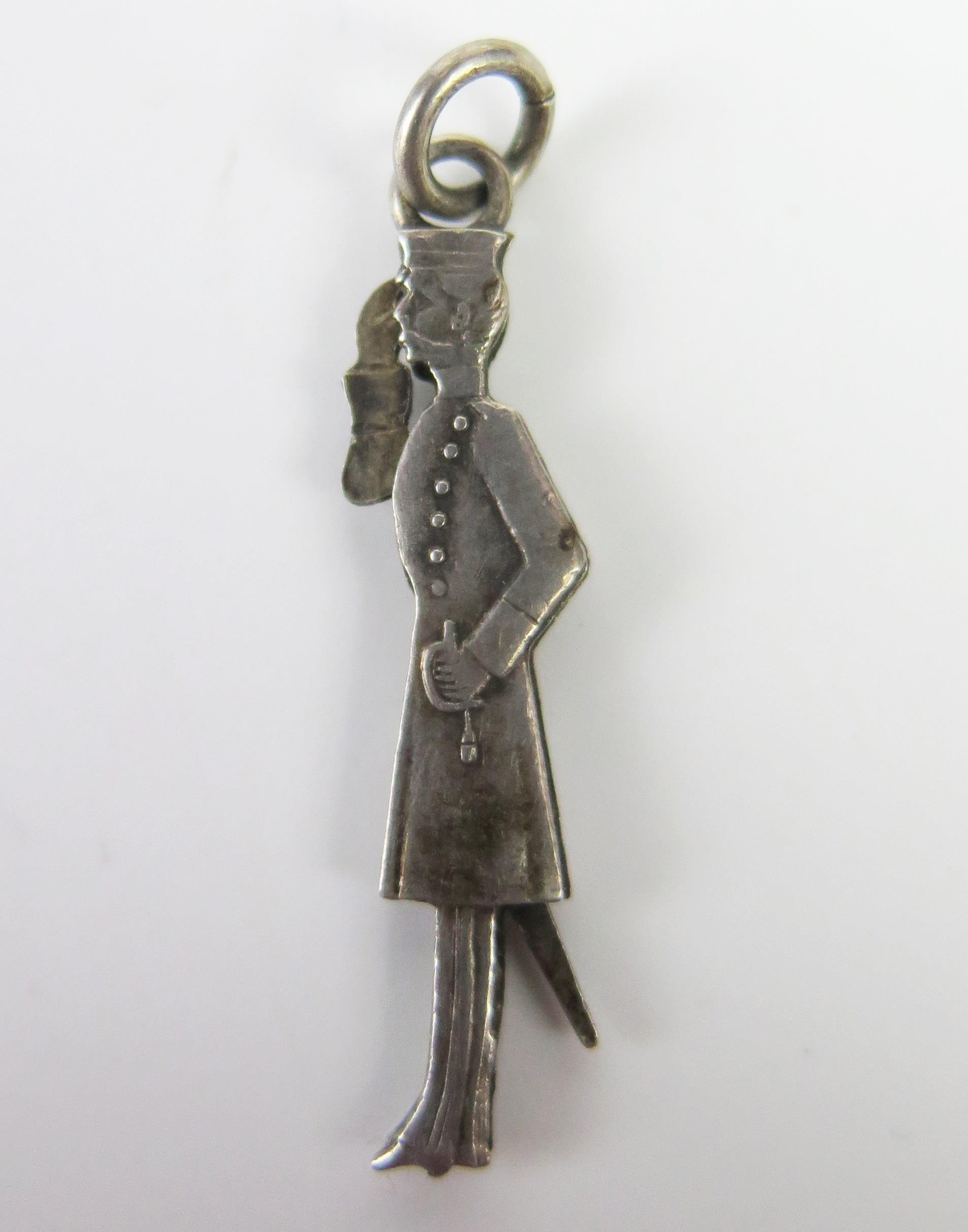 An Antique White Metal Articulated Saluting Officer Pendant, arm moves by adjusting the sword, c.