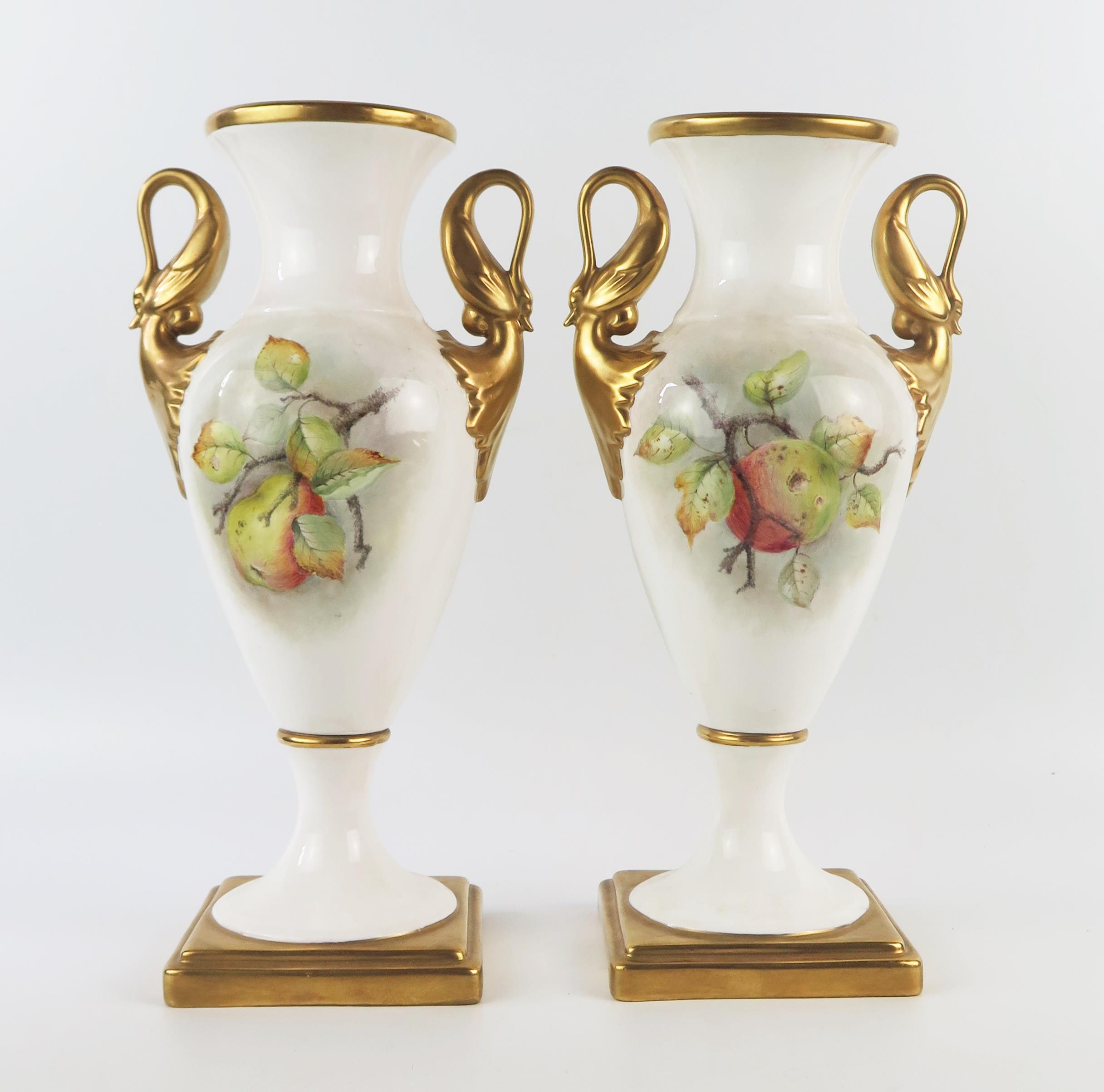 A pair of G Delaney porcelain twin handled vases, of ovoid form, the gilded handles modelled as - Image 3 of 3