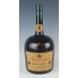 A large Courvoisier Liqueur Cognac glass shop display bottle, 40cm high.