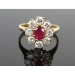A Modern 18ct Gold, Ruby and Diamond Cluster Ring, 14x13mm head, ruby c. 6.5x5.1mm, c. 3.5mm