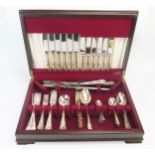 A silver plated six setting flatware service, with shell, scroll and beaded decoration, includes,
