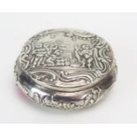 A continental silver circular box, with embossed decoration of a stag and figures, bears import