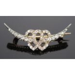 A Victorian Entwined Hearts Crescent brooch set with old cut diamond and in an unmarked gold