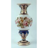 A late Victorian white glass vase of ovoid form, with flared rim, decorated with briar roses, on a