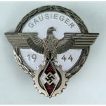 A Third Reich period National Trade Competition Victor enamel and metal badge, stamped to the