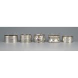 A collection of five assorted silver napkin rings, various maker and dates, total weight of silver