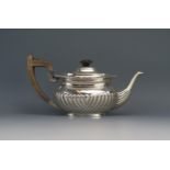 A Late Victorian silver teapot, maker's mark worn, London, 1898, of barge-shaped outline, with