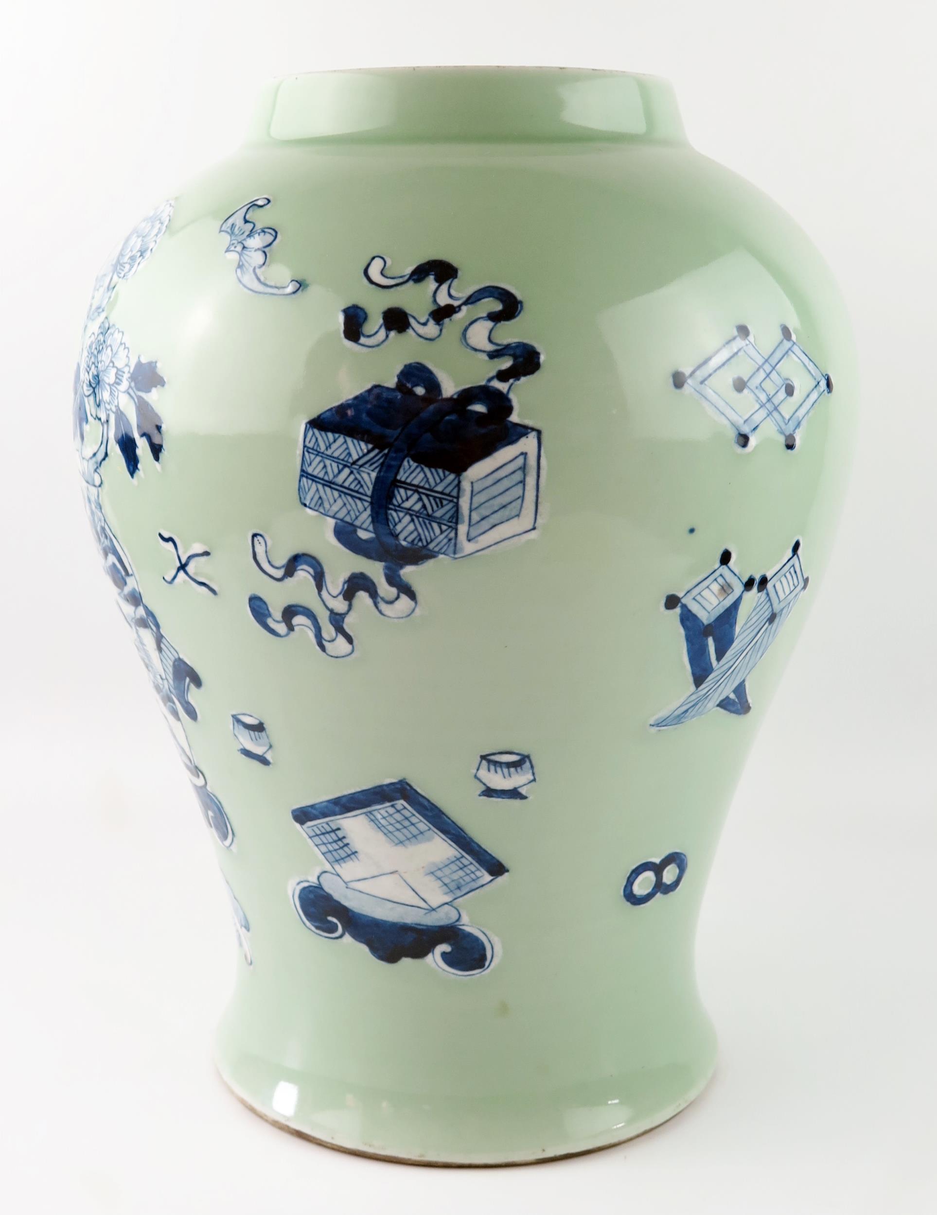 A Chinese vase of ovoid form, with blue and white auspicious objects to a green celadon ground, 37cm - Image 3 of 4