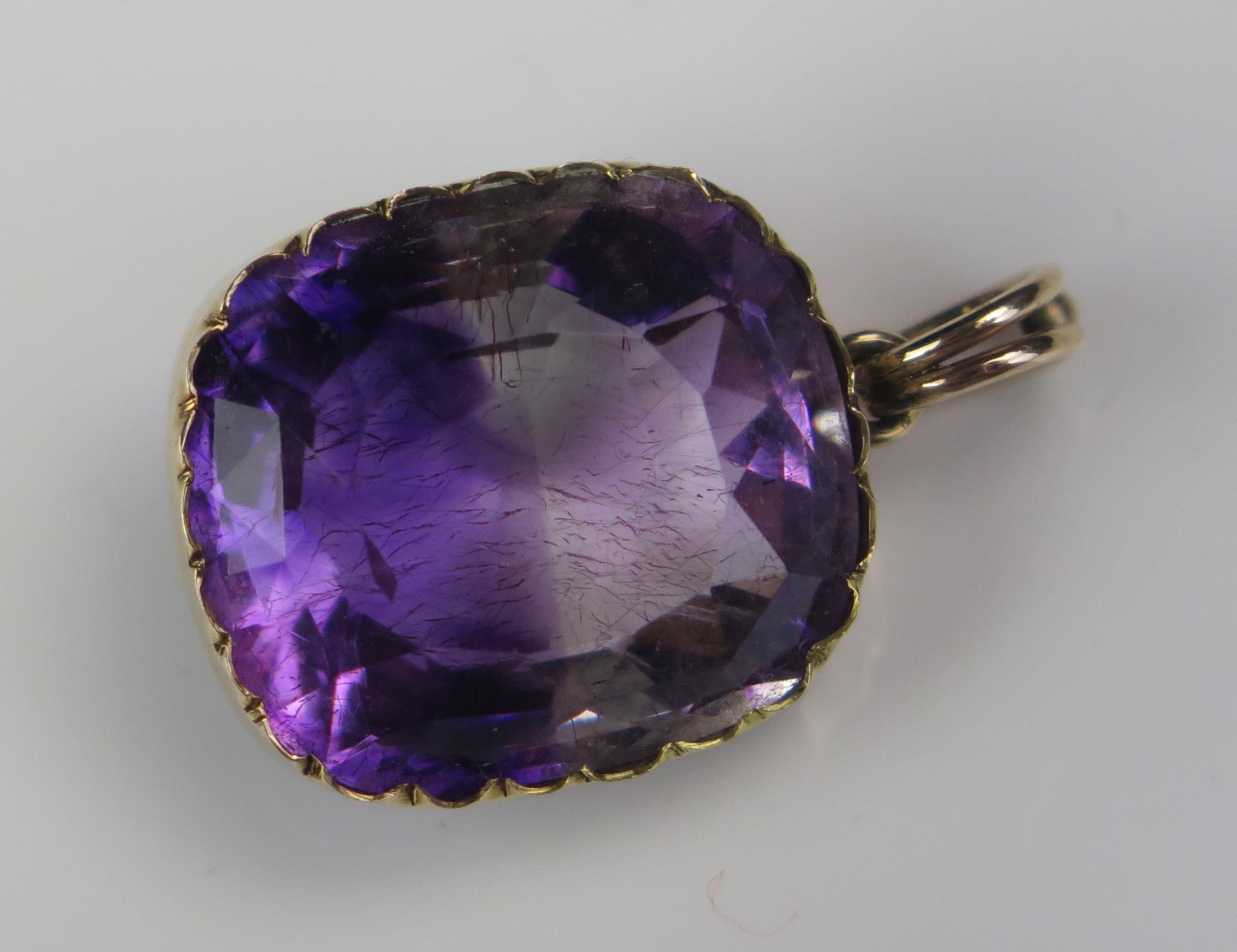 An Antique Amethyst Pendant in an unmarked gold setting, the 18.5x16.2mm stone with clear and purple - Image 4 of 6