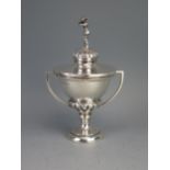A George V silver twin-handled trophy cup and cover, maker Joseph Gloster Ltd, Birmingham, 1935, the