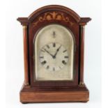 Collis & Russell, Ipswich, a mahogany and inlaid mantel clock of arched outline, with 14cm arched