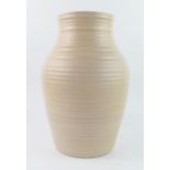 A Clarice Cliff pottery vase of ovoid form with ribbed decoration, 30cm high, A/F.