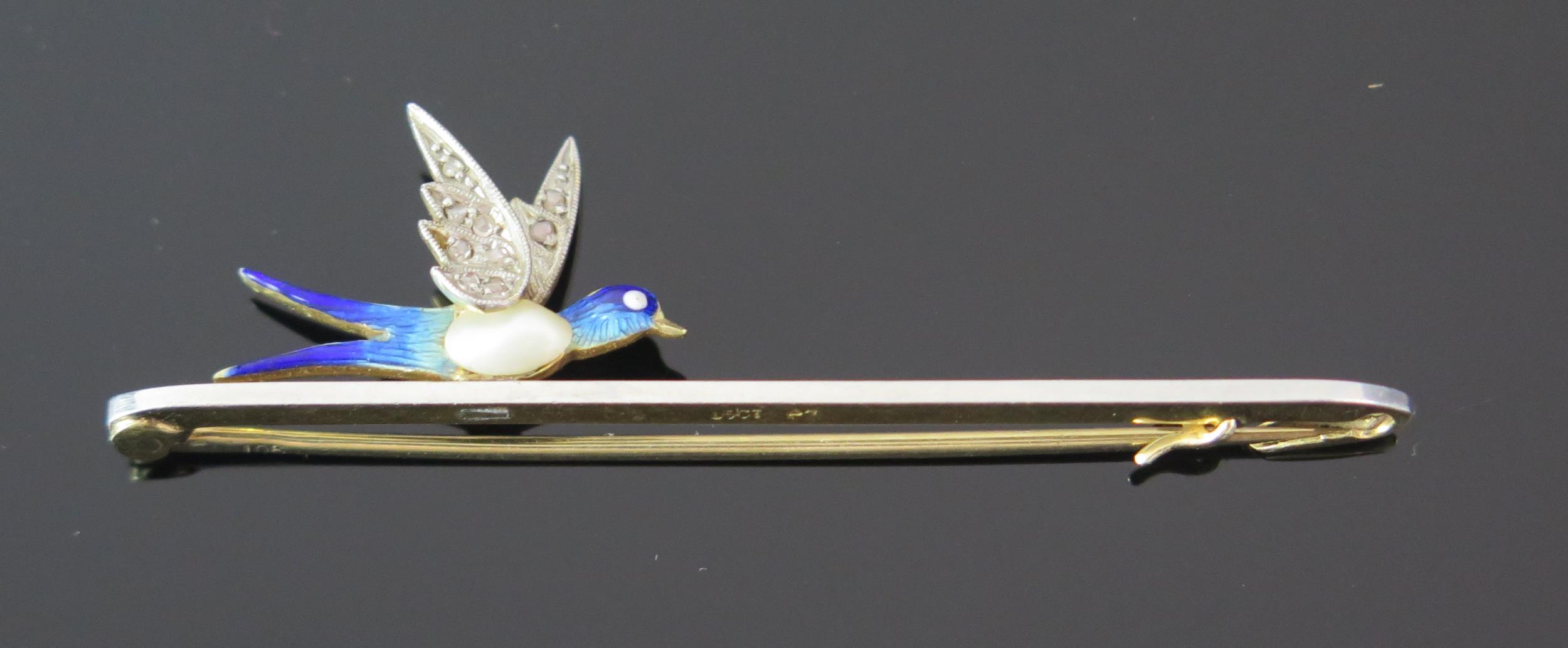 An Antique 15ct Gold and Platinum Swallow Brooch with enamel and baroque untested pearl body and