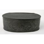 A Chinese pewter oval box, with hinged lid enclosing a compartments interior, with floral decoration