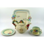 Clarice Cliff a pottery sandwich plate, with floral painted decoration, a teacup , saucer and