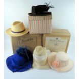 A collection of six ladies formal dress hats together with a straw sun hat,