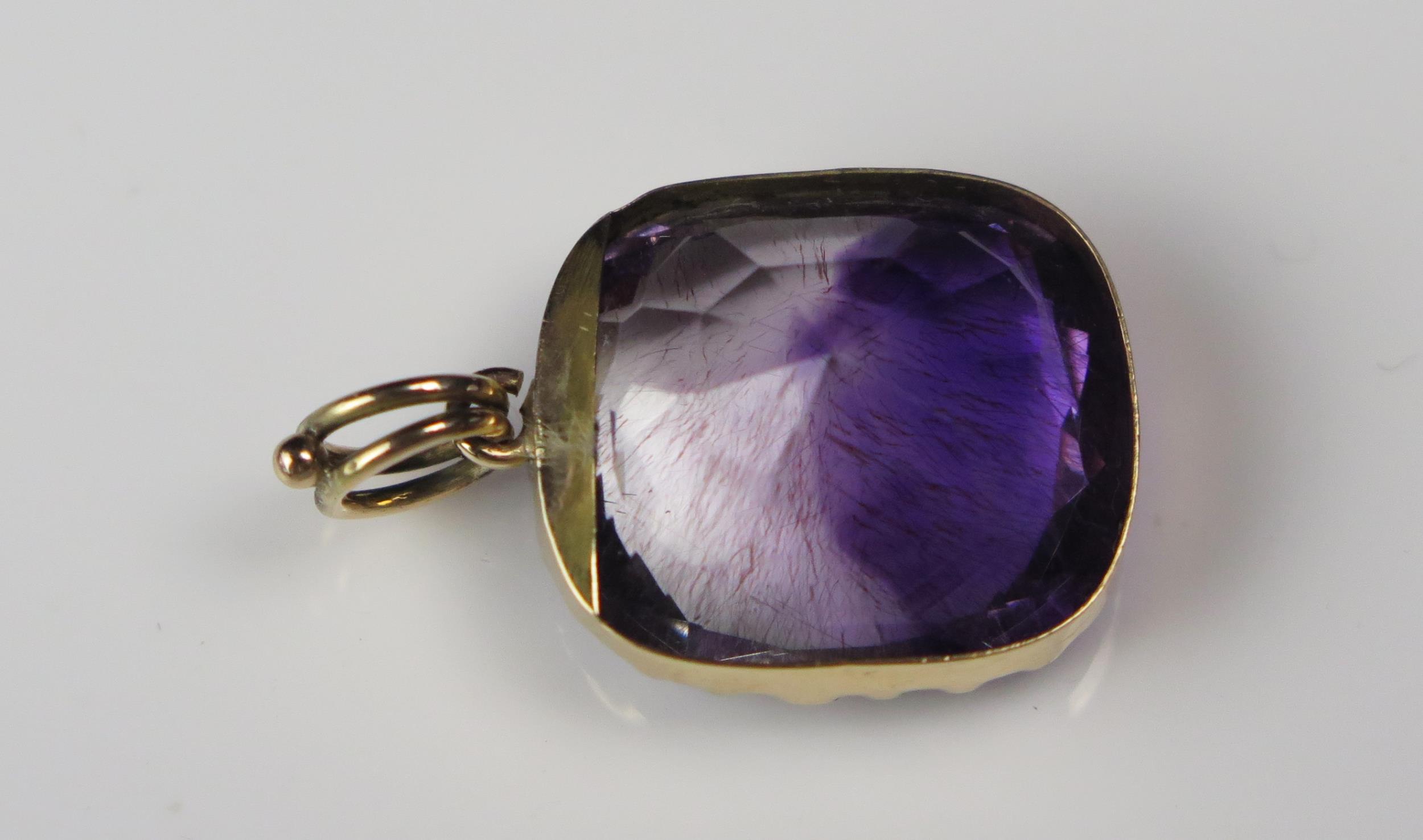 An Antique Amethyst Pendant in an unmarked gold setting, the 18.5x16.2mm stone with clear and purple - Image 3 of 6