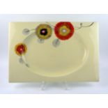A Clarice Cliff Bizarre ware pottery rectangular platter, depicting polychrome abstract daisies,