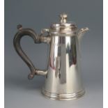 A George V silver hot water jug, maker Goldsmiths & Silversmiths Co Ltd, London, 1926, in the George