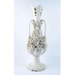 A Parian Bacchanalian vase of slender ovoid form with pierced neck and decorated all over with