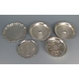 A pair of silver circular coasters, together with three other coasters, various makers and dates,