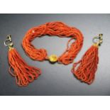 An Antique Multi Strand Coral Necklace with yellow metal clasp and pair of similar earrings with