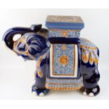 A large modern Chinese pottery jardiniÃ¨re stand in the form of elephant, with polychrome