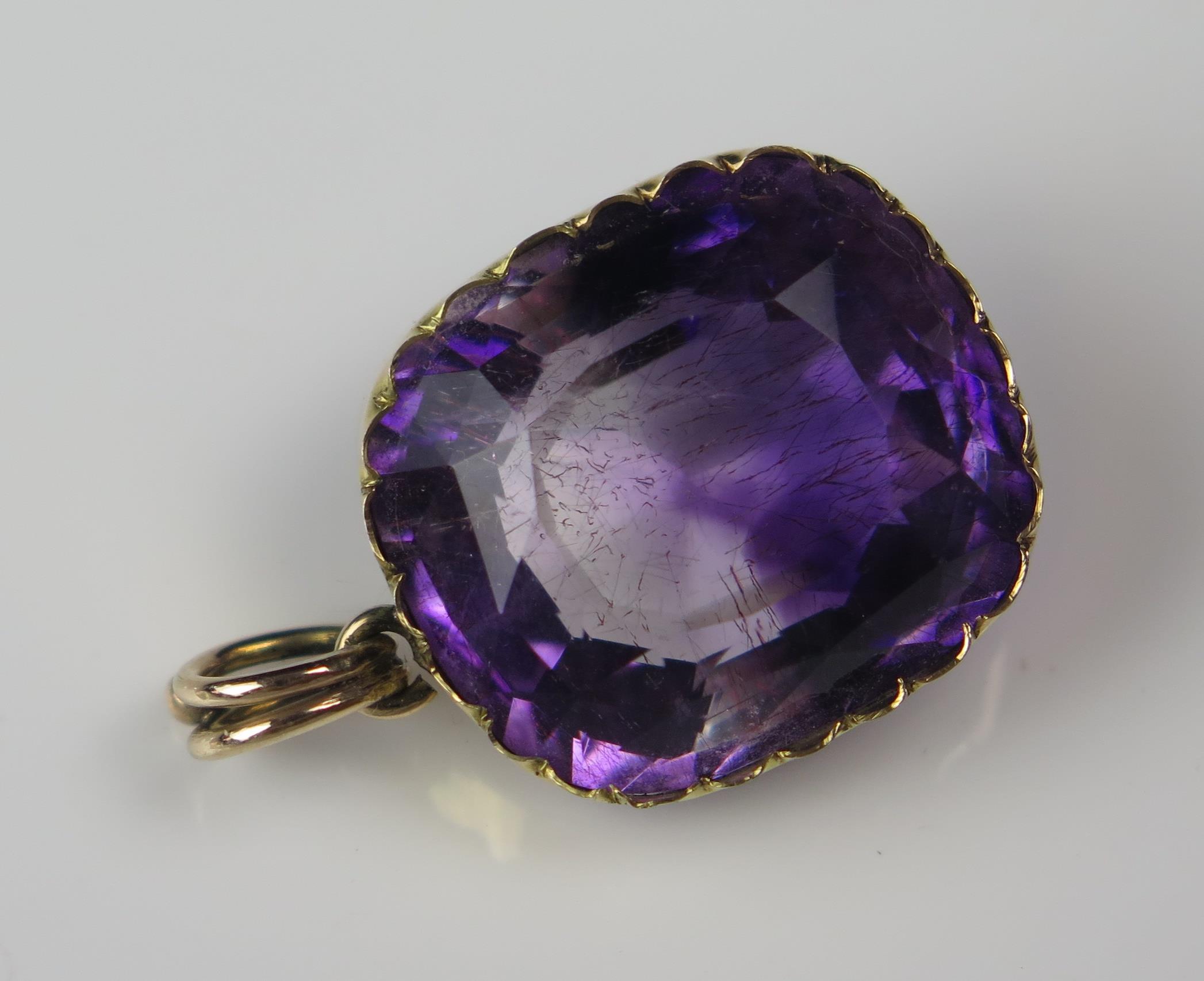 An Antique Amethyst Pendant in an unmarked gold setting, the 18.5x16.2mm stone with clear and purple - Image 2 of 6