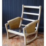 A Folke Ohlsson for Gimson & Slater a teak chair frame, with padded arm rests.