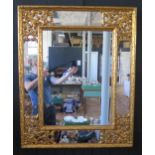 A Belgium reproduction gilt framed marginal wall mirror, of rectangular outline, 102 x 83cm.