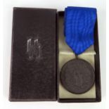 A third Reich period SS four-year service medal, with ribbon, and box.