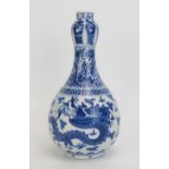 A 18th century Chinese blue and white vase decorated with dragons to the bulbous body, foliate