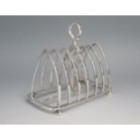 An Edward VII silver six-division toast rack, maker Goldsmiths & Silversmiths Co Ltd, of arched