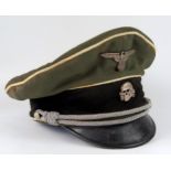 A Third Reich museum piece SS officer's peak cap, with totenkopf and national emblem badges