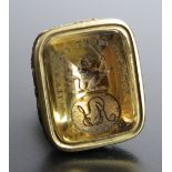A Georgian Gilt Metal Fob Seal, the citrine? matrix engraved with a half length lion bearing a sword