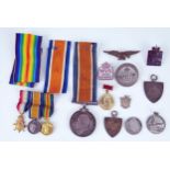 A World War One 1914-18 War Medal to 1542. SJT J, Harris. Manch.R. a miniature World War One trio,