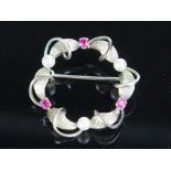 A Platinum, Spinel and untested Pearl Brooch, 31.5mm diam. 4.6g