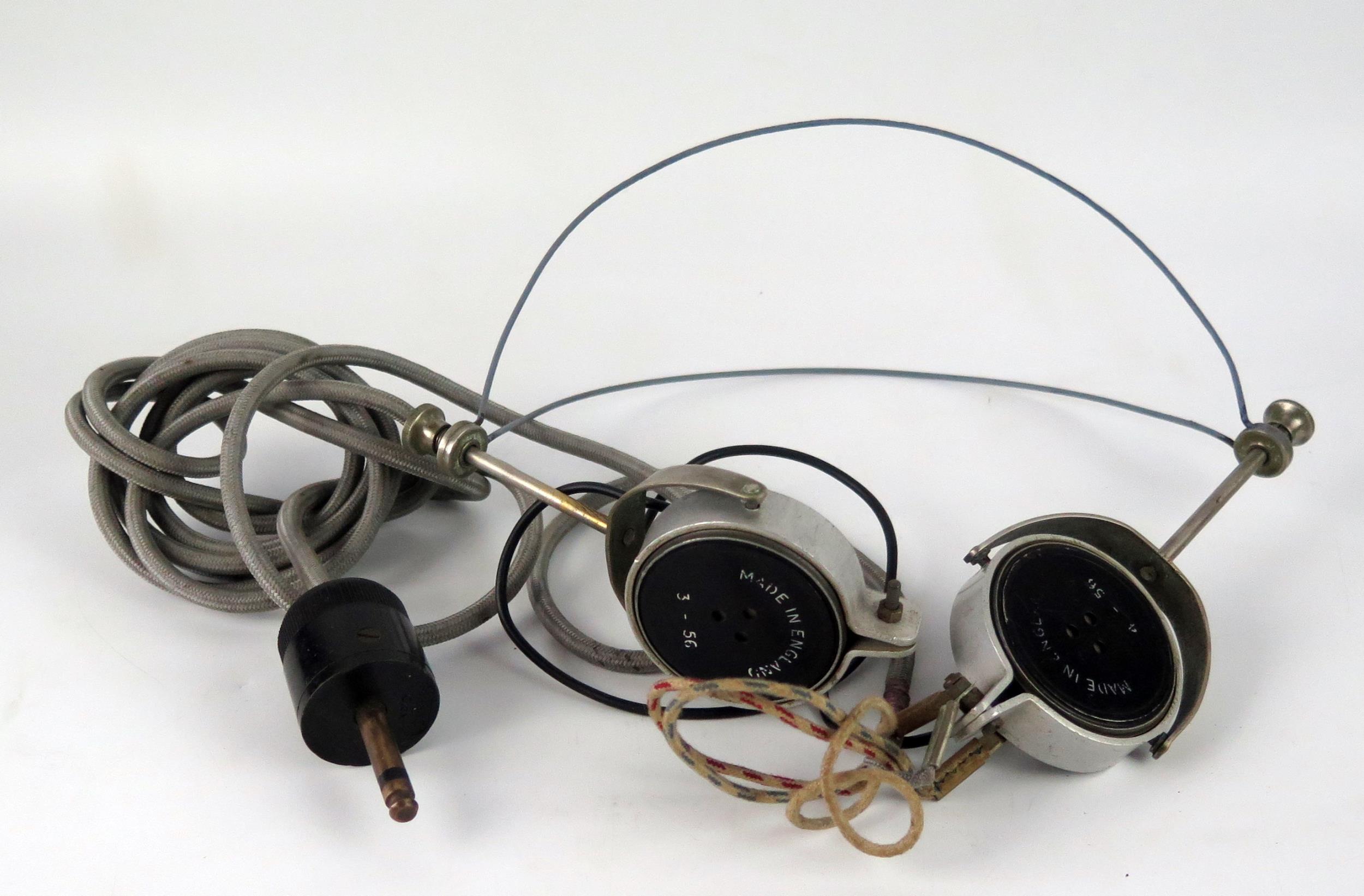 A pair of World war II period British army headphones, cable and plug.