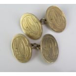 A Pair of 9ct Gold Cufflinks, the 19.5x13.5mm panels engraved with monograms, 10.1g