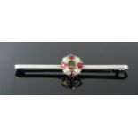 A 15ct White Gold and Platinum Brooch set with red and white paste, 44mm, 2.4g