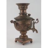 A Persian plated samovar of small size, of ovoid outline raised on a square base with ball feet,