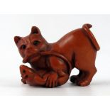 A Japanese carved boxwood netsuke of a cat and mouse, unsigned, 5cm long.