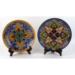 Two Talavera pottery plates, with polychrome floral decoration, each 23.5cm diameter.