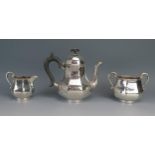 An Edward VII silver bachelors three-piece tea service, maker Holland, Aldwinckle & Slater,
