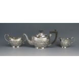 An Edward VII silver three-piece oval tea set, maker T E Beardsmore, Birmingham, 1908/09, with