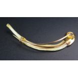 A Yellow Metal Mounted Wishbone? Brooch, 62mm, 4g and presented in the original Goldsmiths &